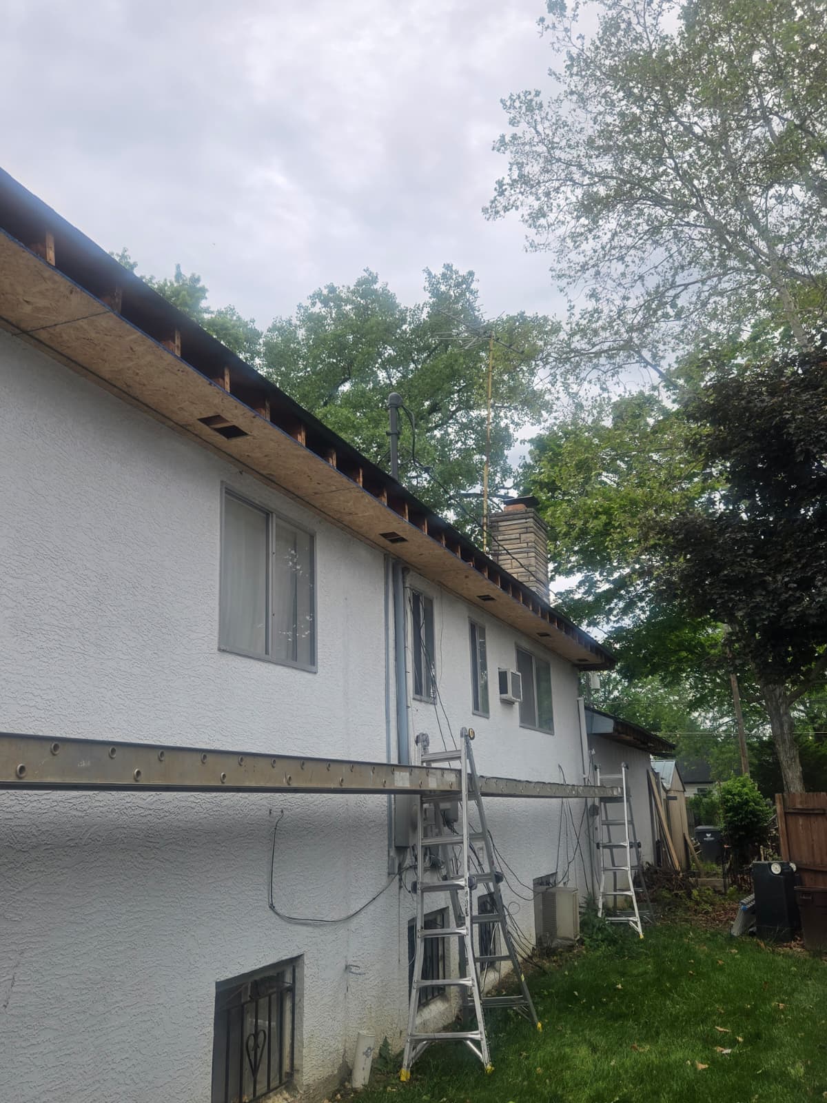 Vented soffit panels installed under roof eaves